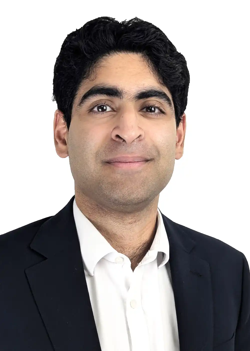 Arjun Seth V2 - Colman Coyle Head-and-shoulders portrait of a man in a white shirt and dark blazer, smiling slightly.